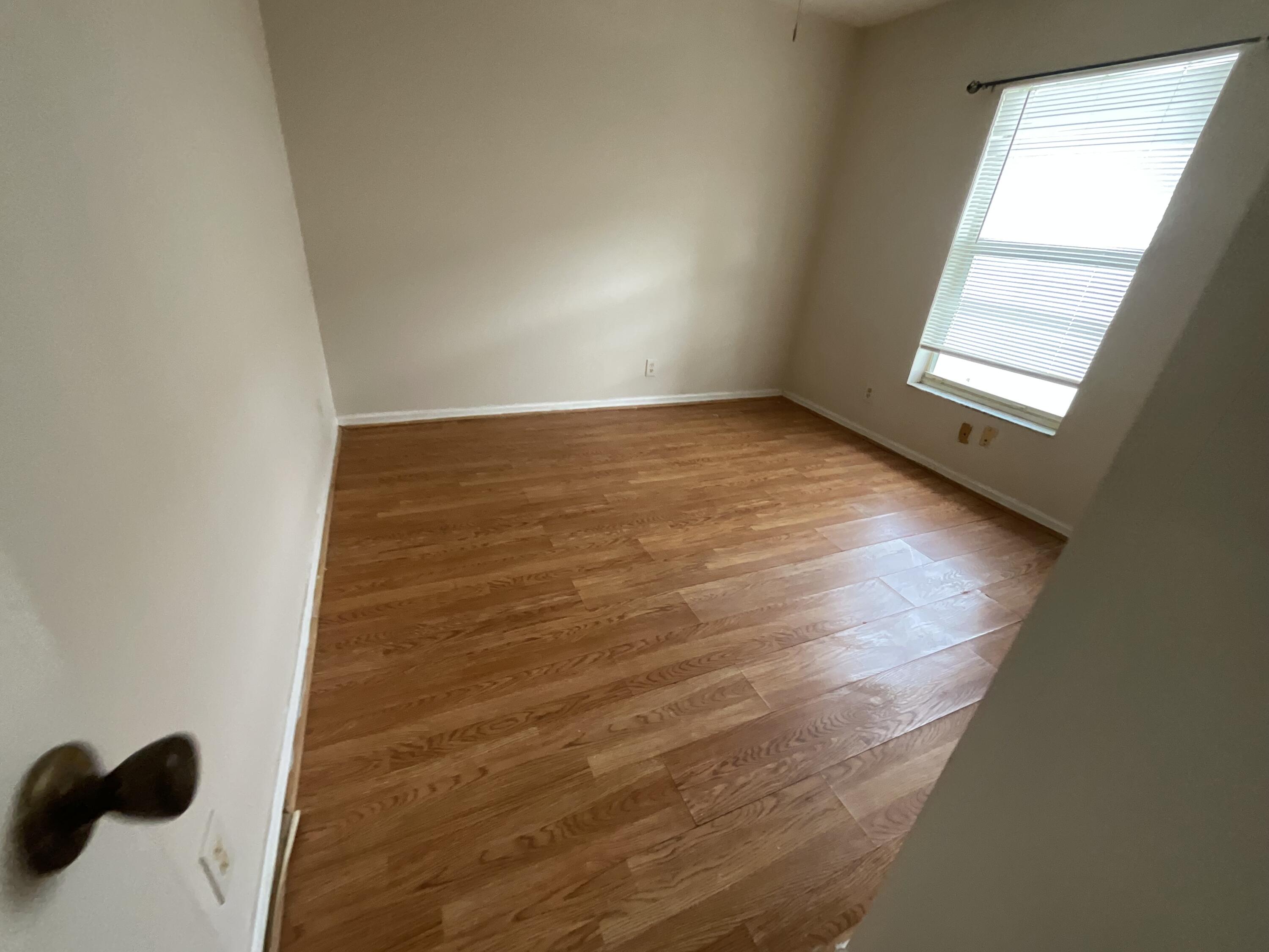 1002 Southwest Romaine Lane Port St. Lucie, FL 34953 - Photo 17 of 26 an empty room with windows