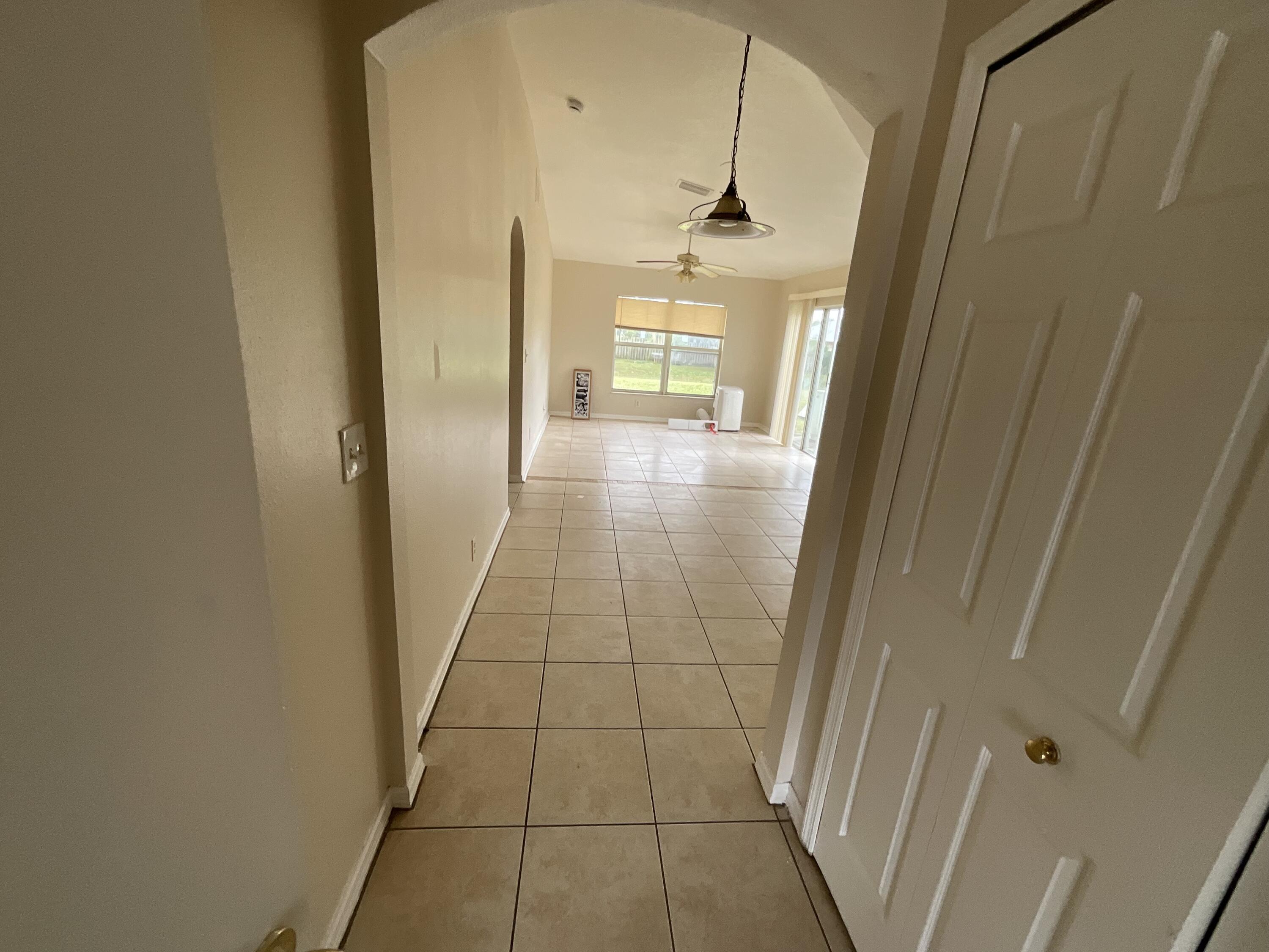 1002 Southwest Romaine Lane Port St. Lucie, FL 34953 - Photo 18 of 26 a view of hallway with wooden floor