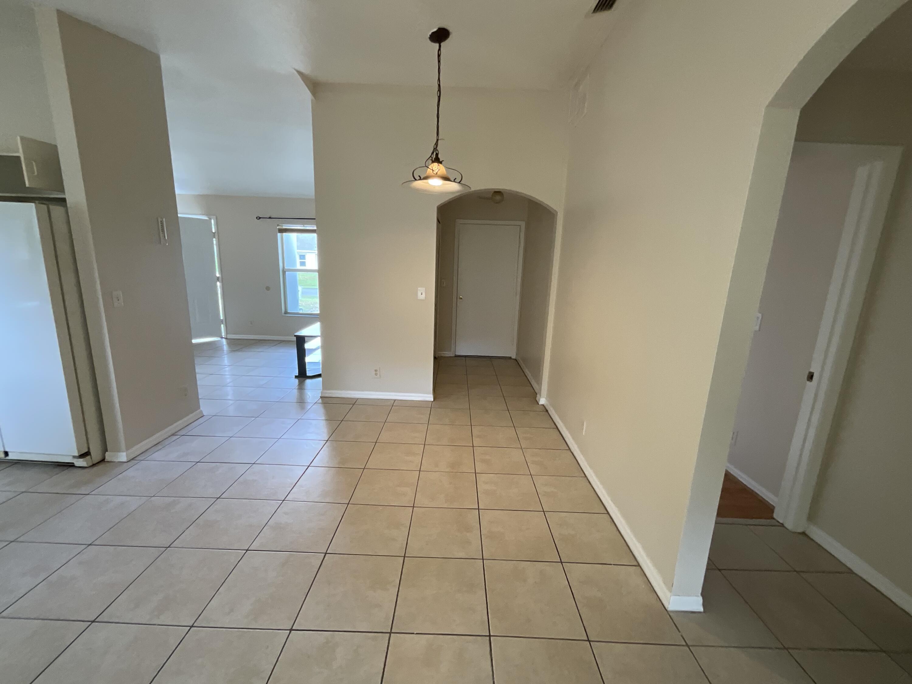 1002 Southwest Romaine Lane Port St. Lucie, FL 34953 - Photo 23 of 26 a view of a livingroom with a pathway
