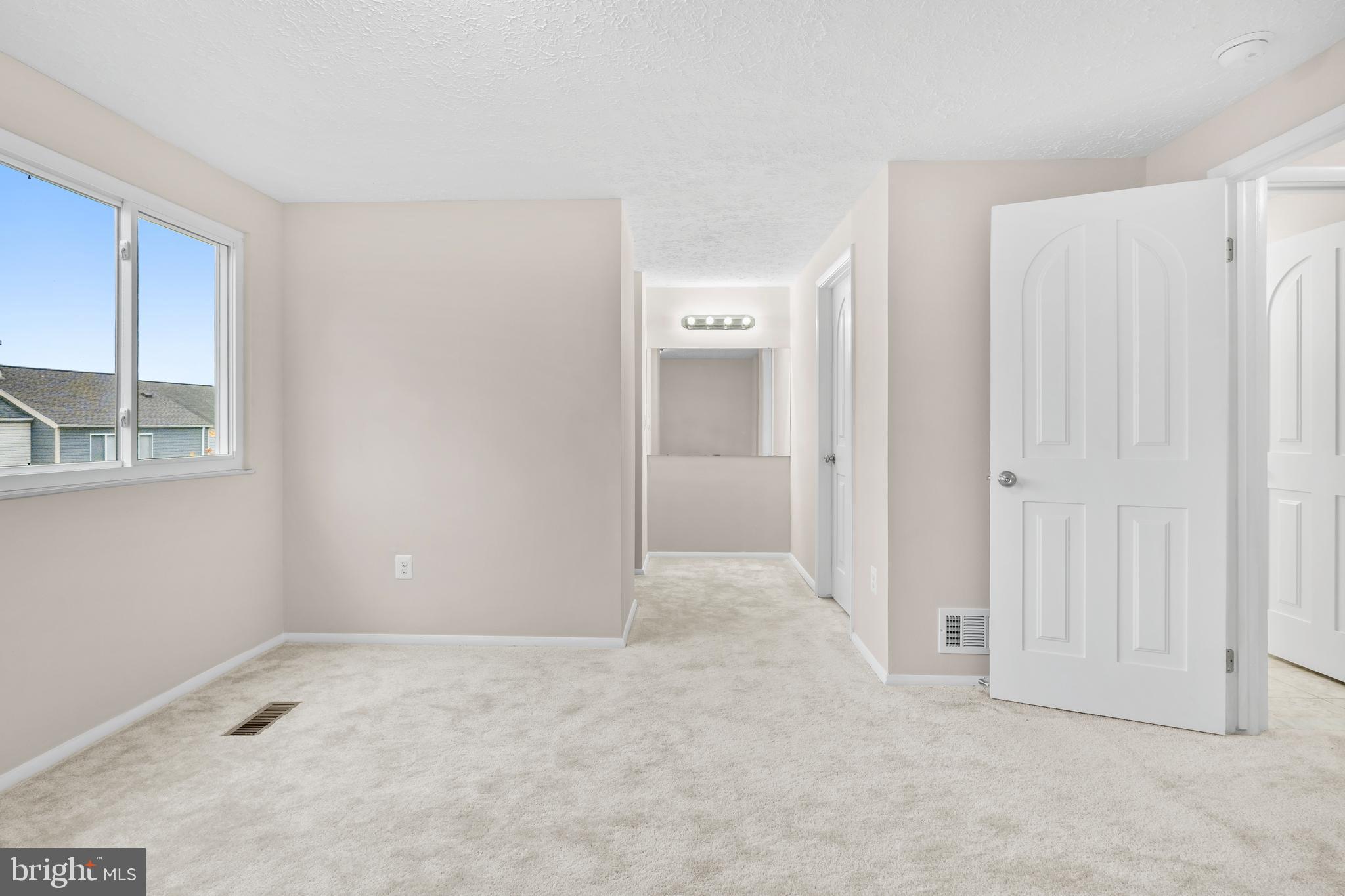 9998 Tuscarora Road Randallstown, MD 21133 - Photo 13 of 21 an empty room with windows and closet