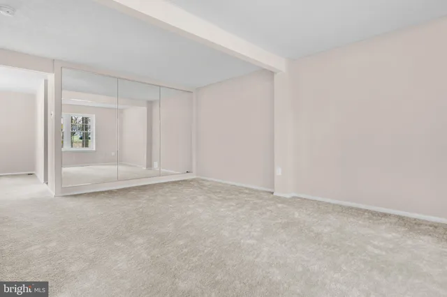 a view of an empty room and window