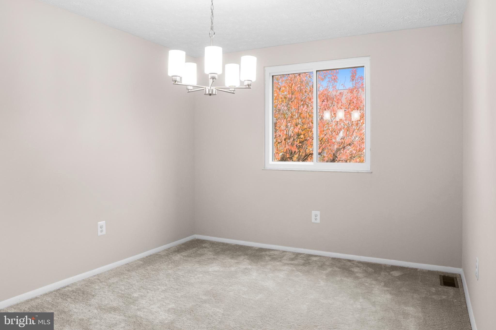 9998 Tuscarora Road Randallstown, MD 21133 - Photo 5 of 21 en empty room with windows