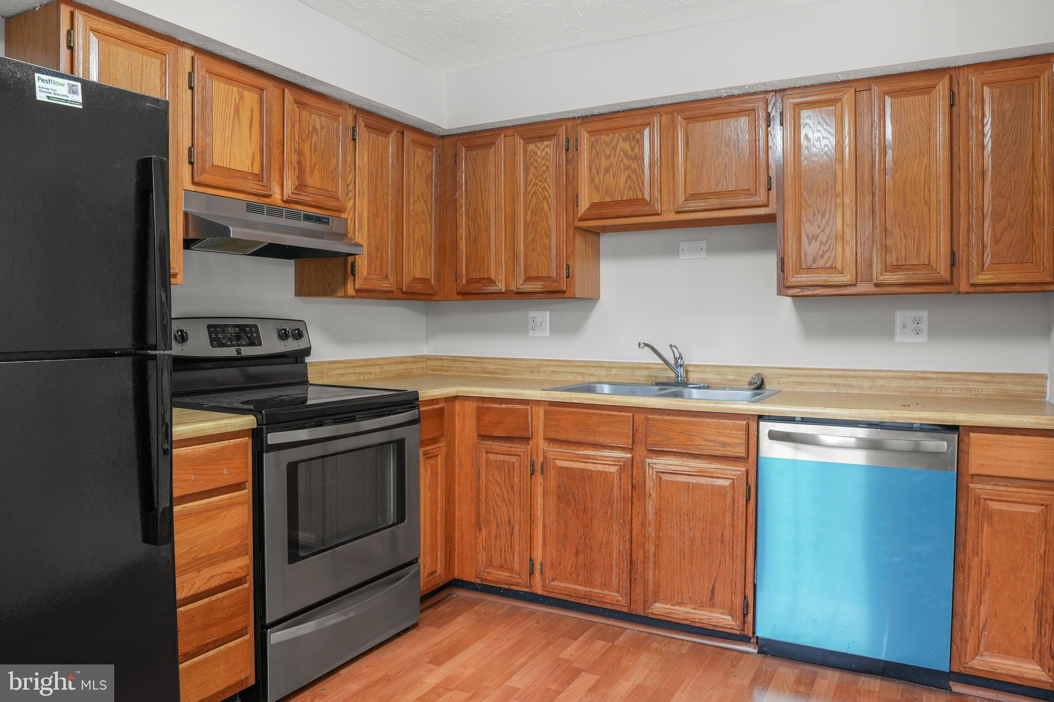 9998 Tuscarora Road Randallstown, MD 21133 - Photo 9 of 21 a kitchen with stainless steel appliances granite countertop a refrigerator sink and cabinets