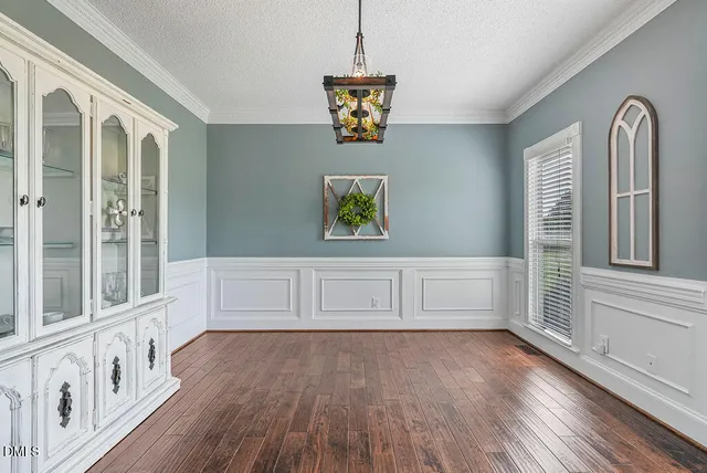 a kitchen with stainless steel appliances granite countertop a refrigerator a stove and a sink