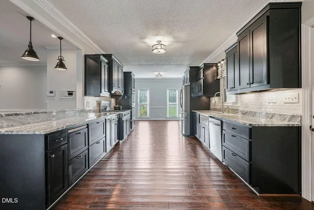 a bathroom with a toilet a sink and a window