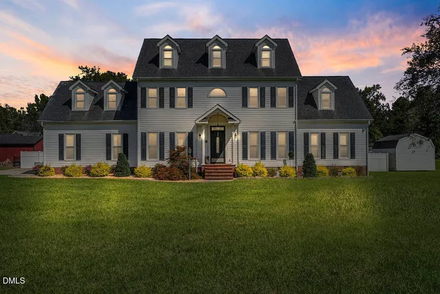 a view of a big house with a big yard