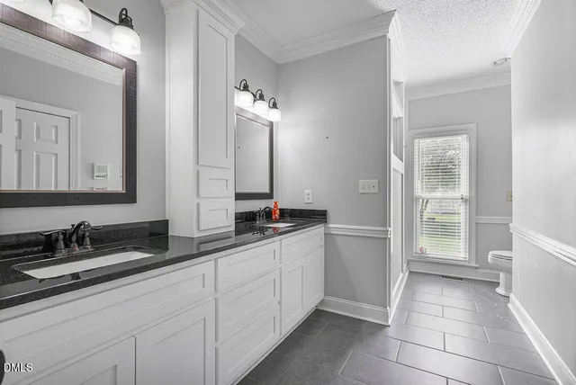 a view of staircase with railing and white walls