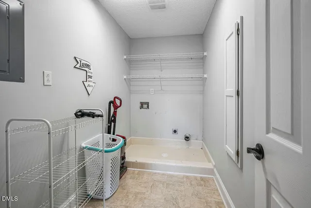 a view of a house with backyard and porch