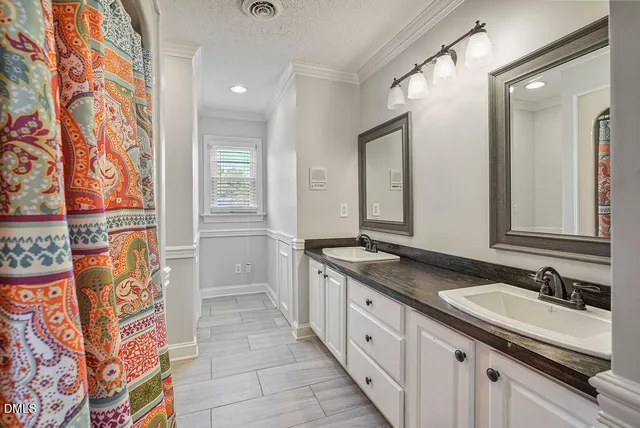 an aerial view of a house with a garden statue