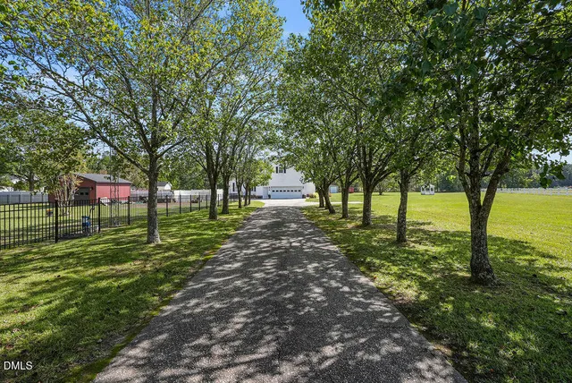 a view of staircase with wooden floor and a window