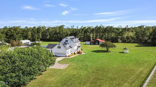 a spacious bathroom with a granite countertop sink and a mirror