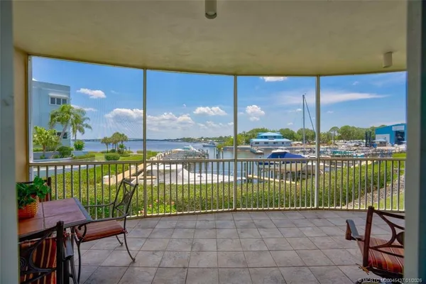 a view of a porch with a floor to ceiling window