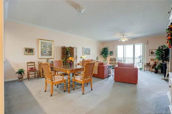 a view of a dining room with furniture window and outside view