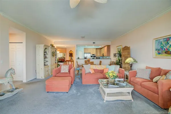 a living room with furniture and a table