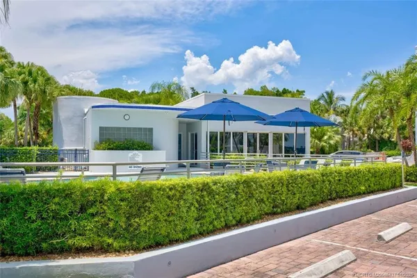 an aerial view of a house with a swimming pool