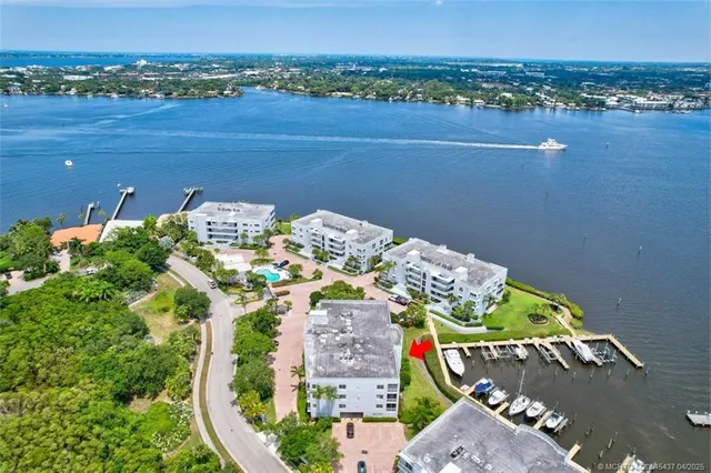 an aerial view of a house with a lake view