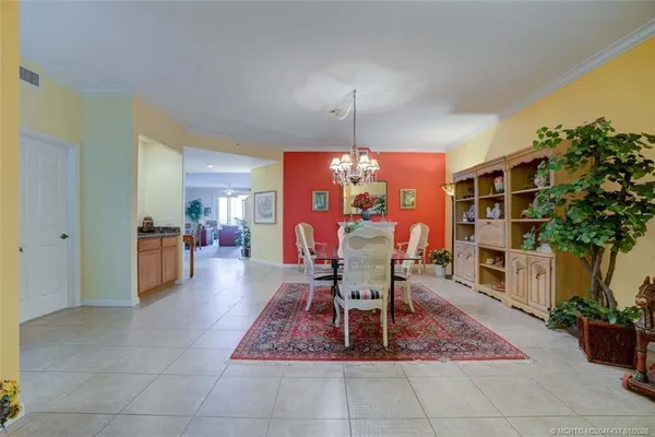 a dining room with a table and chairs