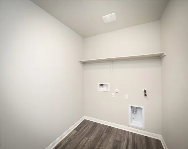 a view of a small space with wooden floor