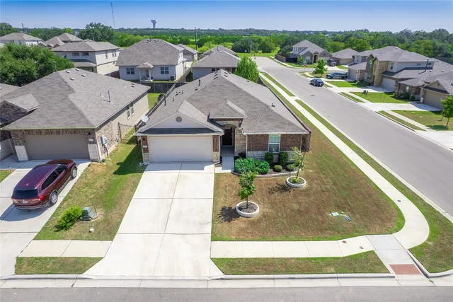 an aerial view of a house with swimming pool
