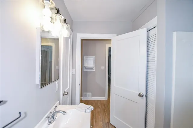 a bathroom with a bathtub and sink