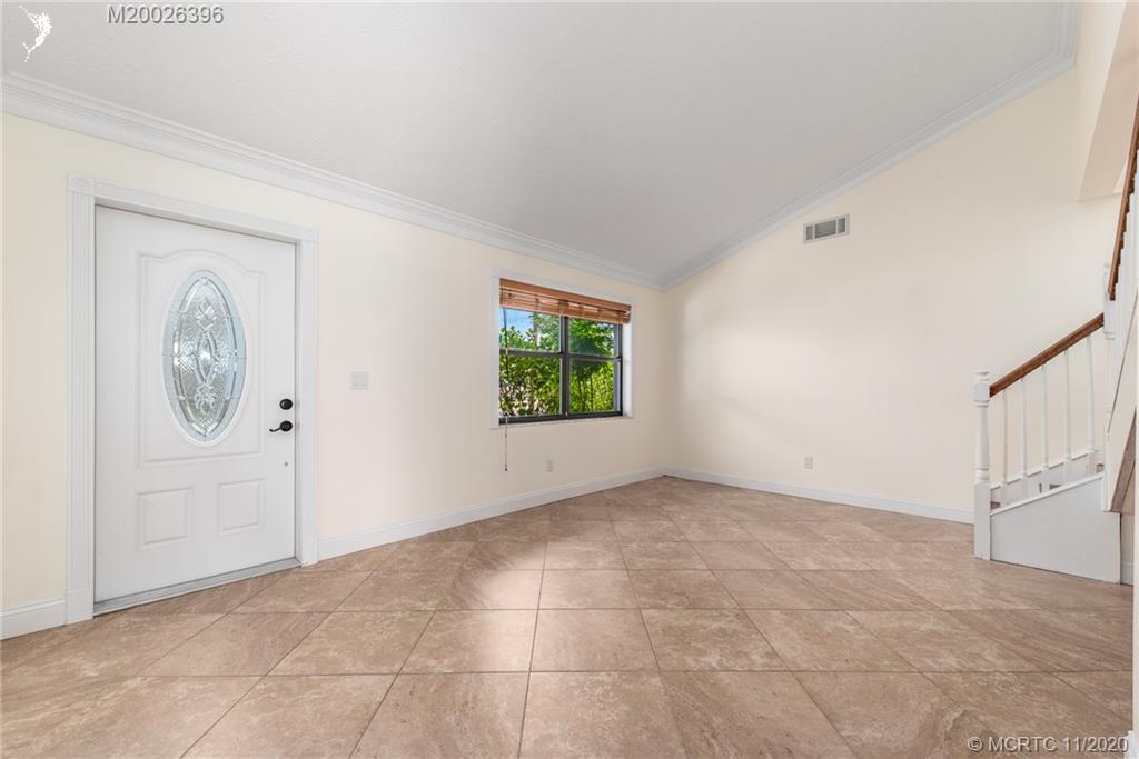 1239 Southwest Dyer Point Road Palm City, FL 34990 - Photo 14 of 34 an empty room with windows