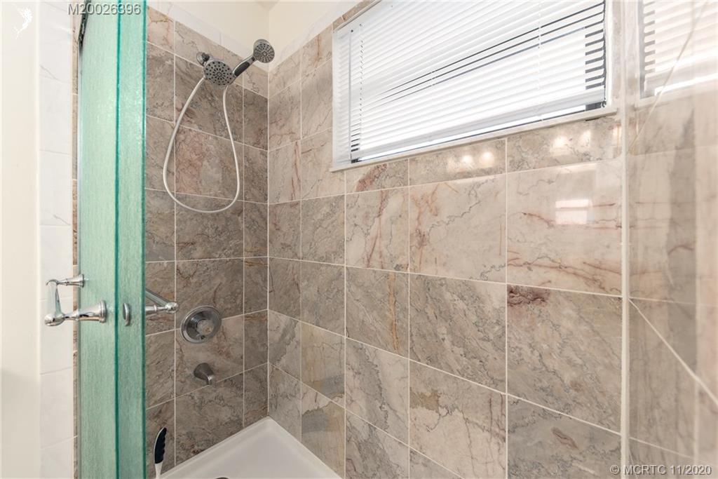 1239 Southwest Dyer Point Road Palm City, FL 34990 - Photo 24 of 34 a bathroom with a shower