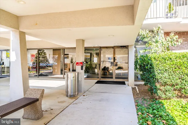 a view of hallway with wooden floor