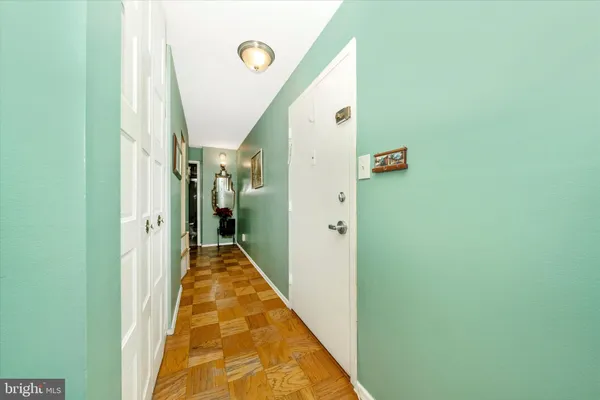 a view of a hallway with white walls