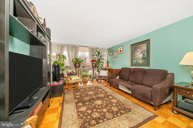 a living room with furniture and flat screen tv