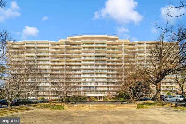 a front view of a building with a swimming pool