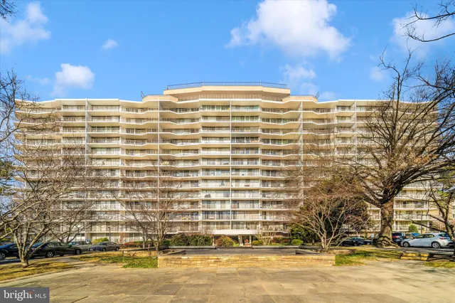 a front view of a building with a swimming pool