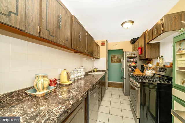 a utility room with multiple dryer and washer