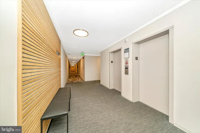 a view of a hallway with front door