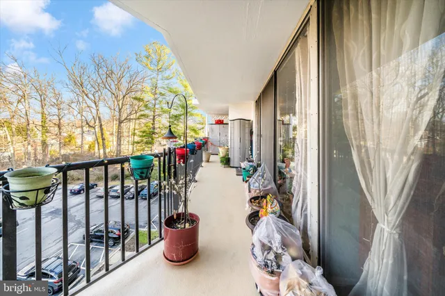 a view of a balcony with furniture