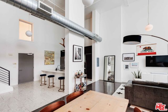 a living room with furniture and flat screen tv