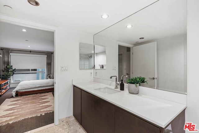 a view of living room with furniture and potted plant