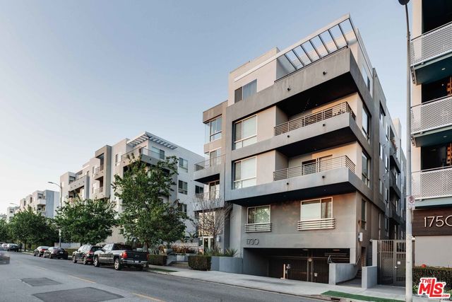 a front view of a building with parking