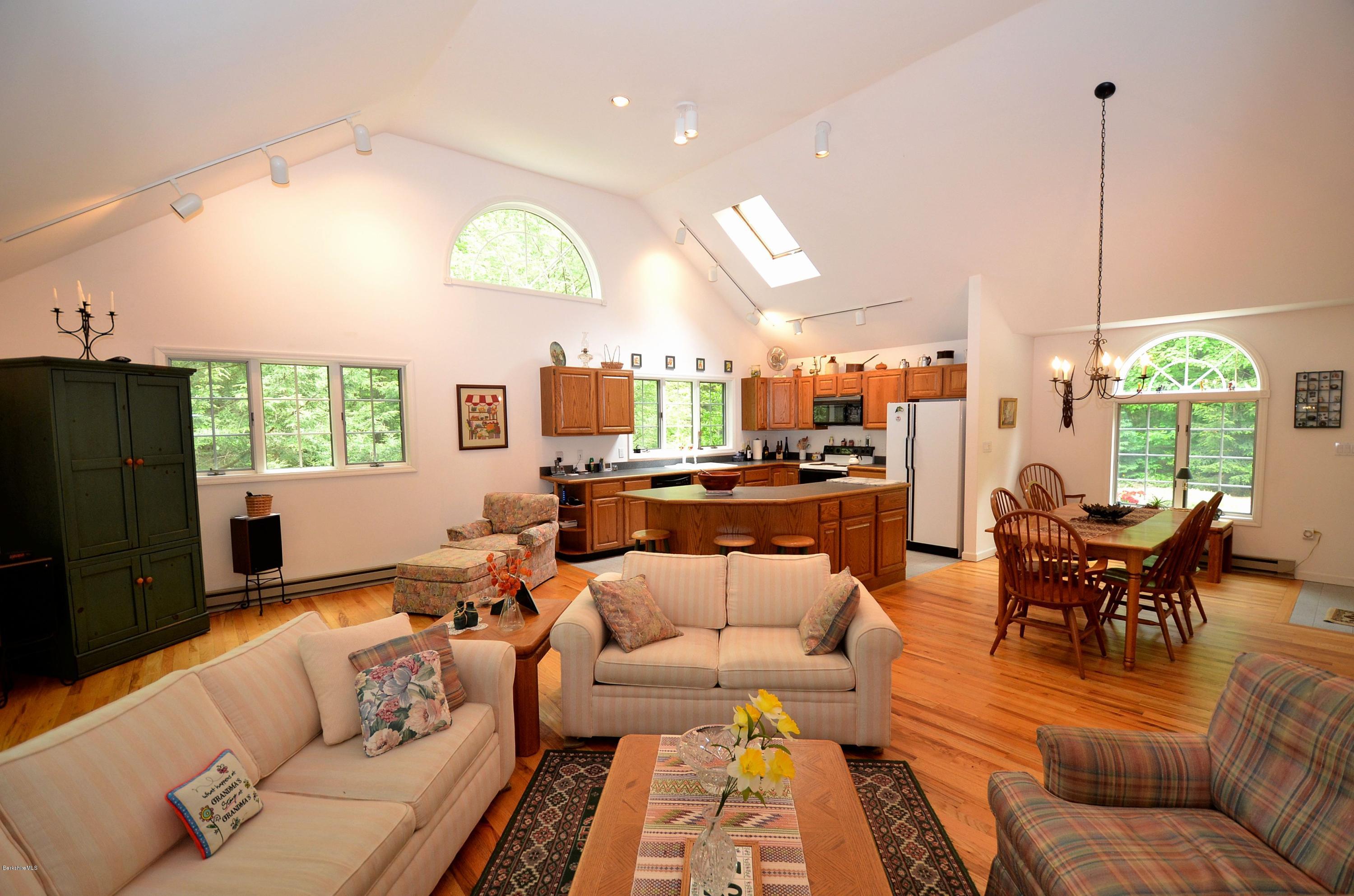 52 Monterey Road Tyringham, MA 01264 - Photo 5 of 10 a living room with furniture kitchen view and a large window