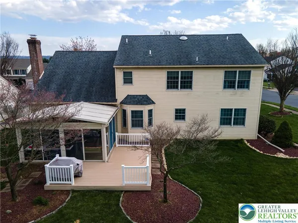 an aerial view of a house with a garden