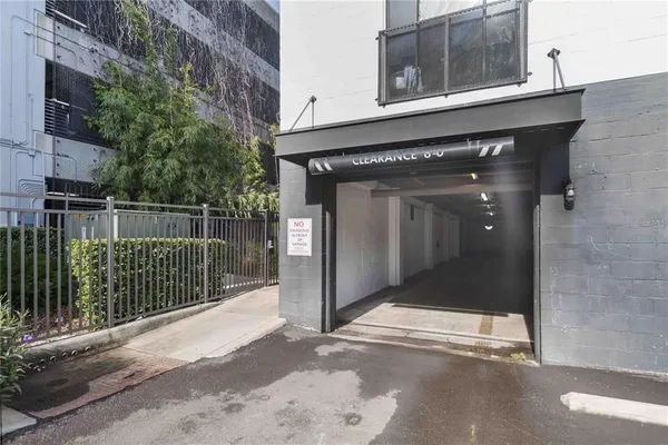 a view of parking garage with cars