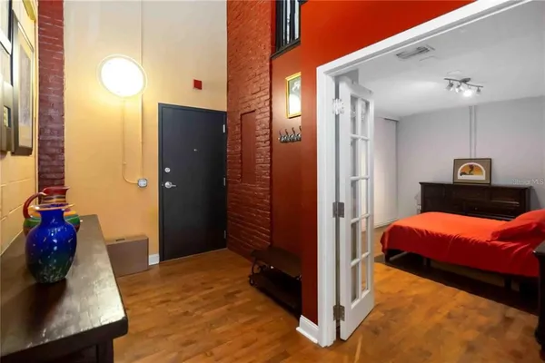 a bedroom with a bed and a dresser