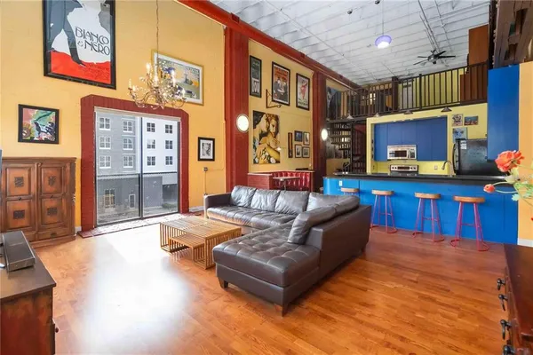 a living room with furniture and a potted plant