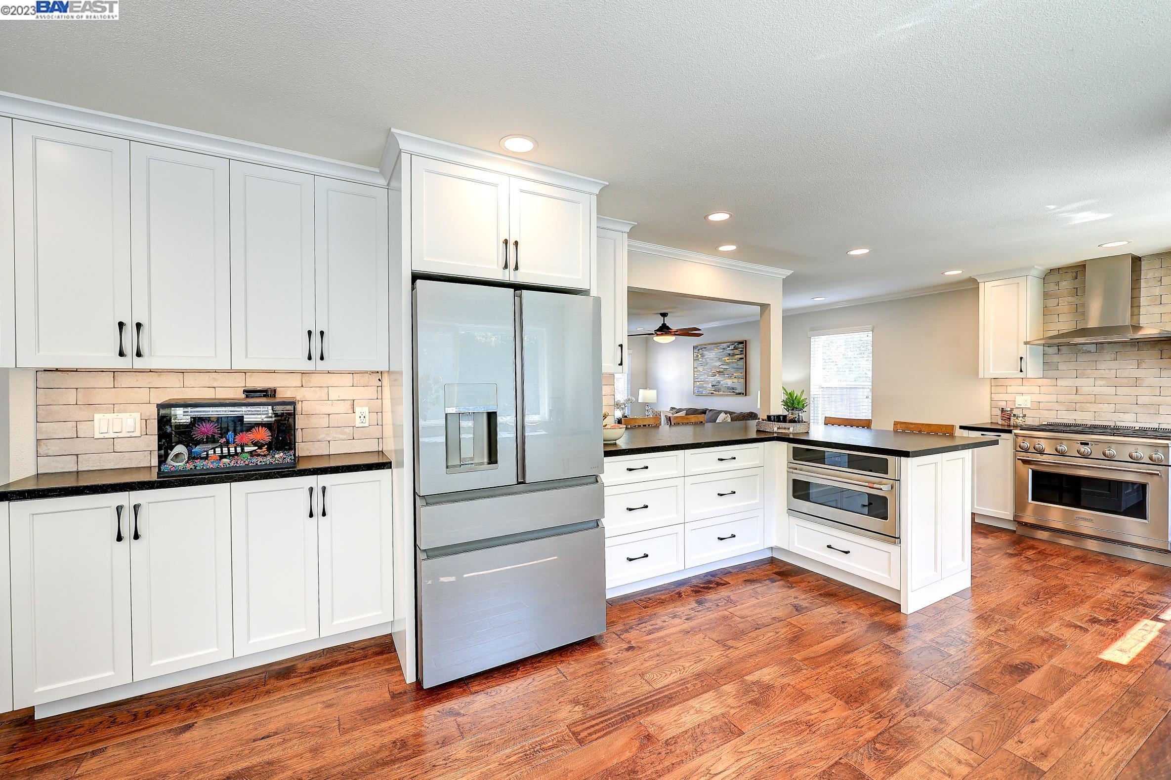 520 Eagle Nest Drive Martinez, CA 94553 - Photo 1 of 1 a kitchen with granite countertop white cabinets and stainless steel appliances