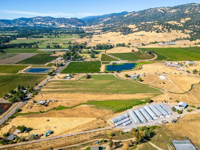 an aerial view of a house with a ocean view