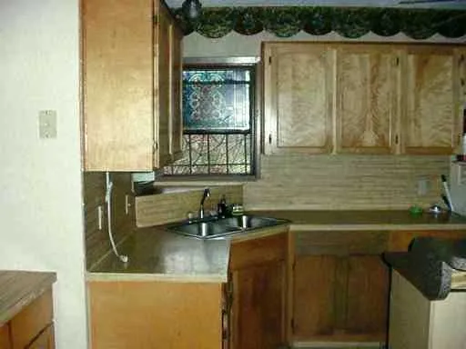 a bathroom with a sink a mirror and a bathtub