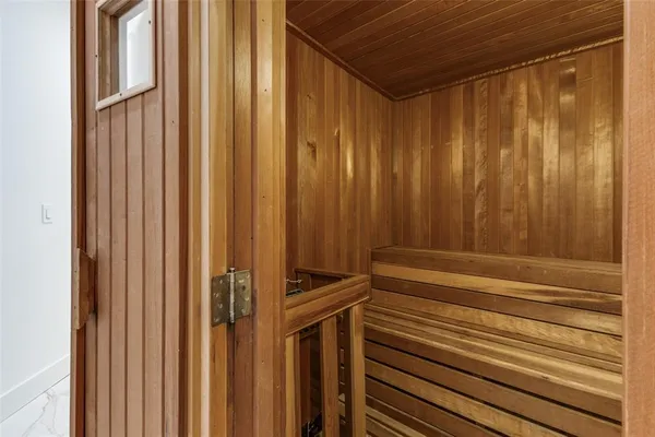 a bathroom with a shower and a sink