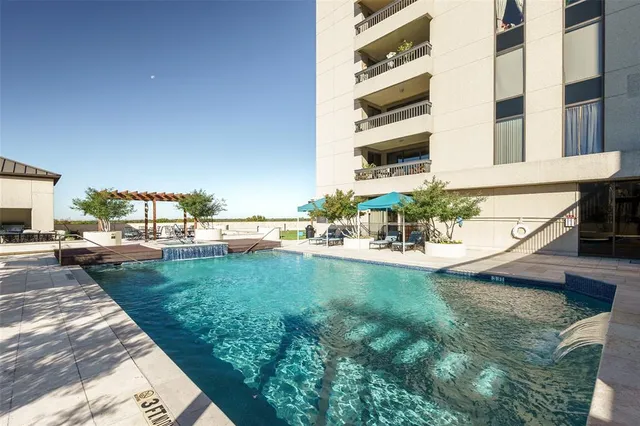 a view of a patio with a table and chairs