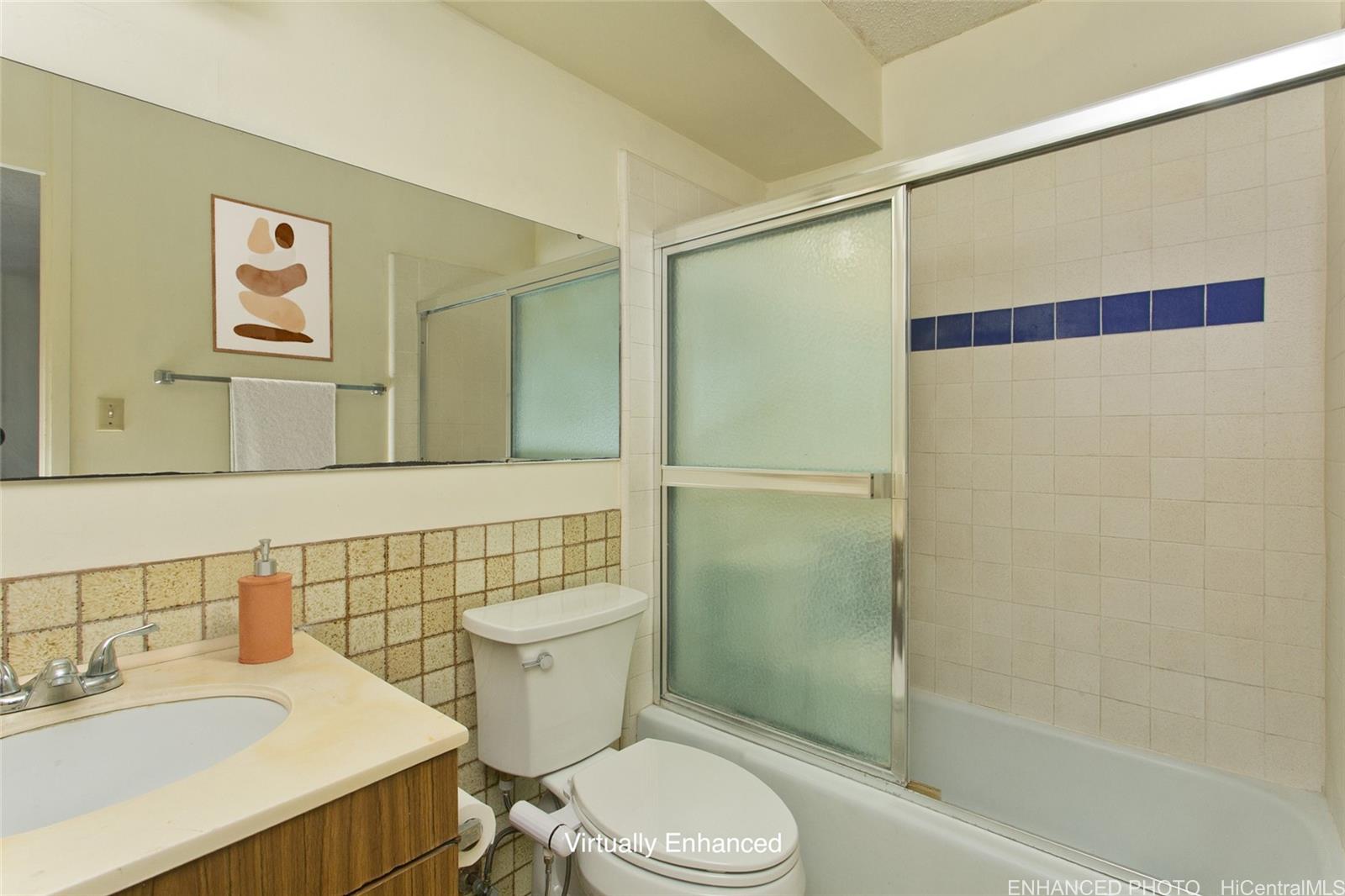 818 South King Street, Unit 907 Honolulu, HI 96813 - Photo 11 of 16 a bathroom with a sink toilet and shower