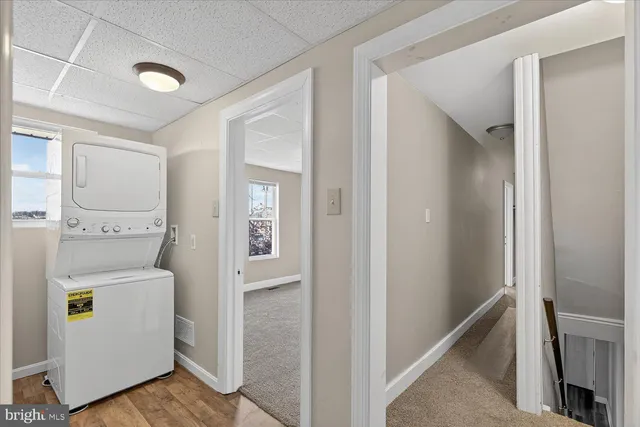 a view of hallway with wooden floor