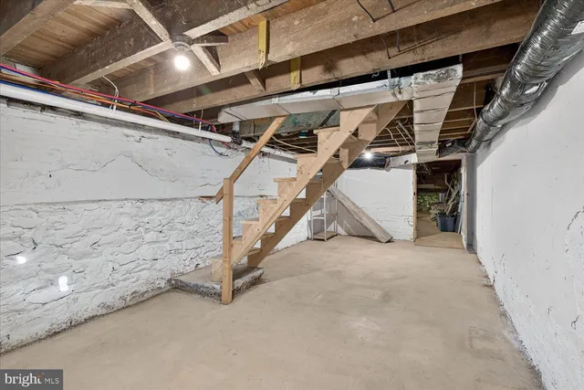 a view of a house with barbeque and stairs